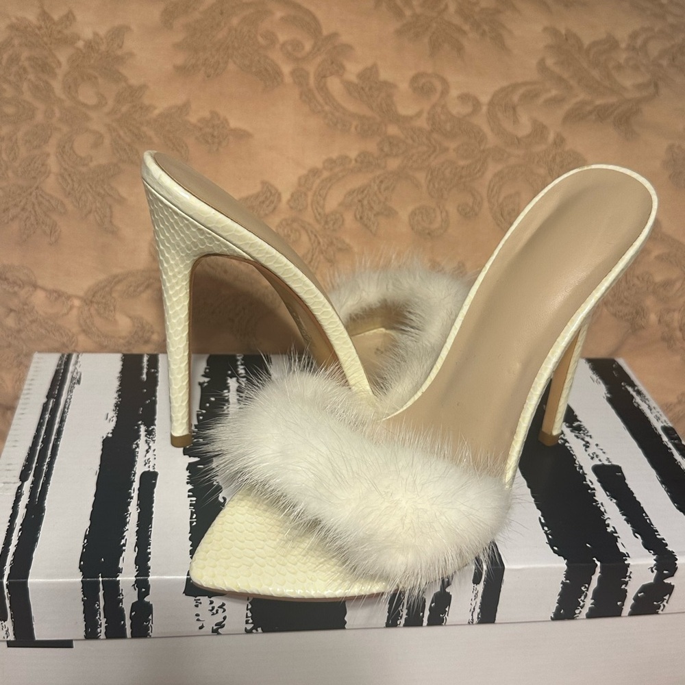 Off white feather heel, hardly worn